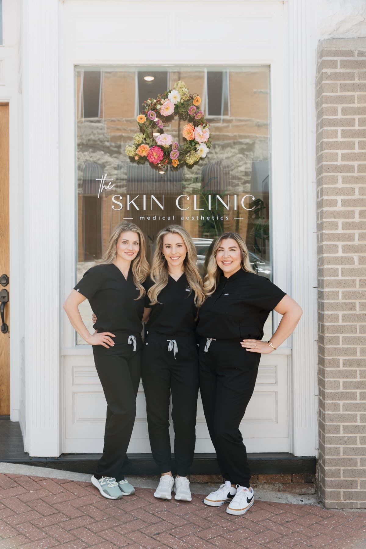 The team outside The Skin Clinic in downtown Siloam Springs